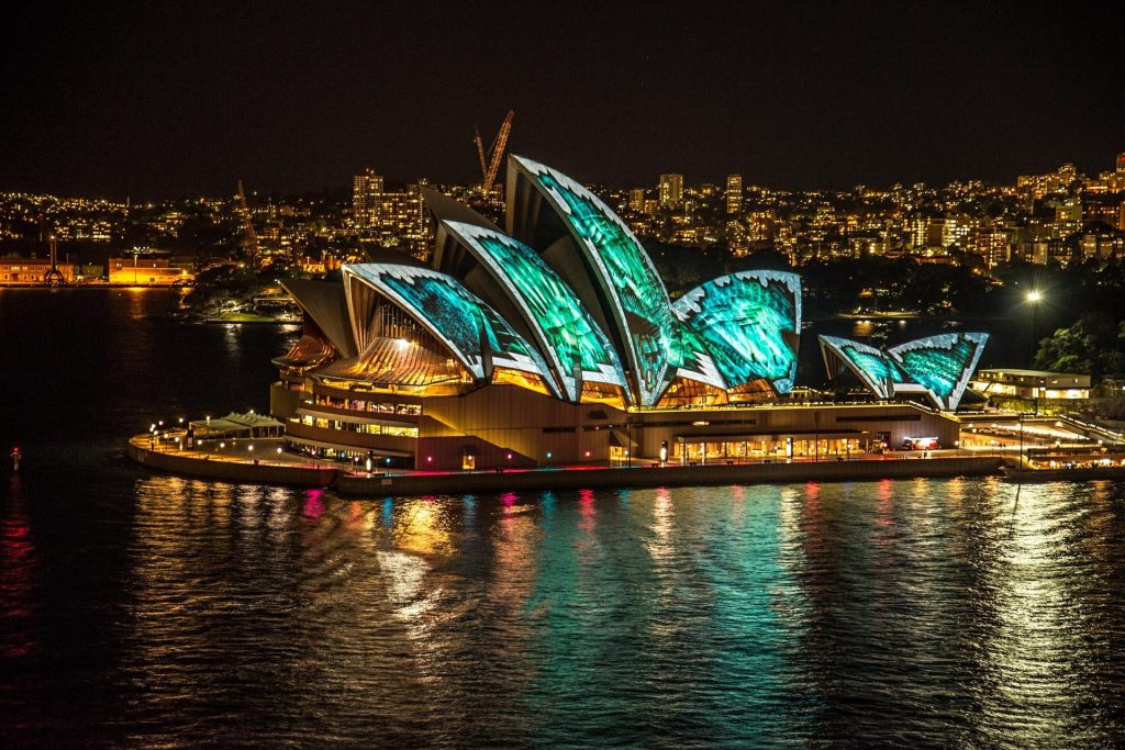 sydney opera house at night with lights