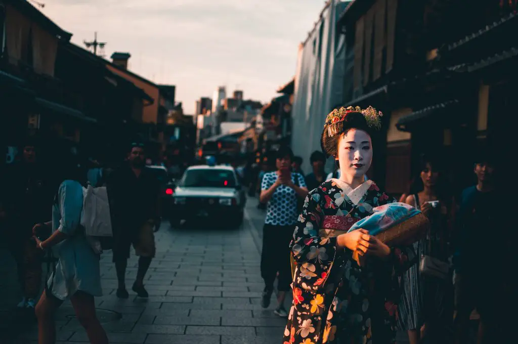 Geisha walking on a street